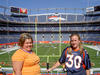 Sarah and I before a Denver Broncos game.  (I'm in orange)