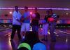 im the guy with shorts on and blue shirt and it is cosmic bowling