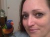 This is me and Rowdy, one of my rainbow lorikeets